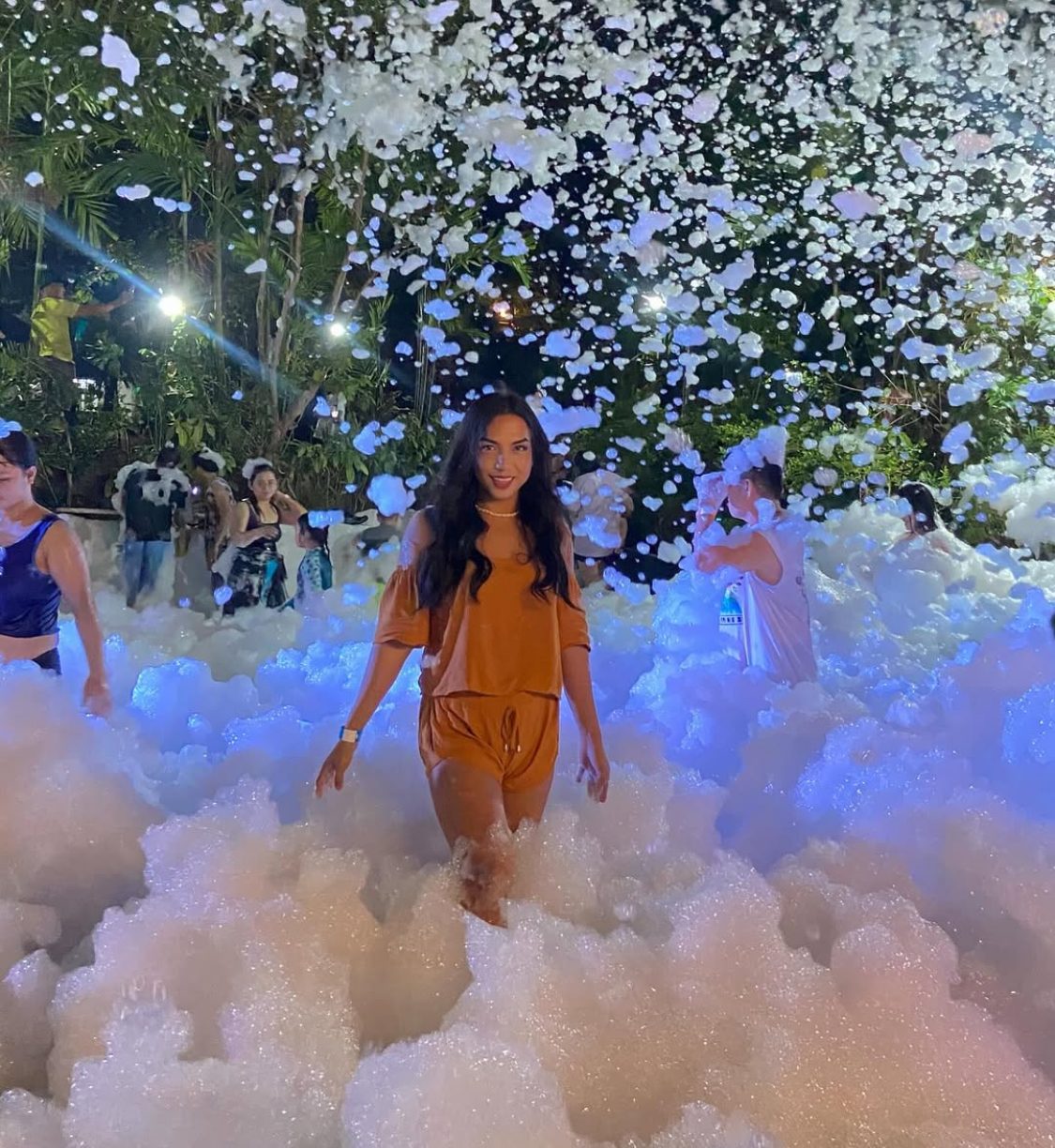 Nighttime foam party with lights